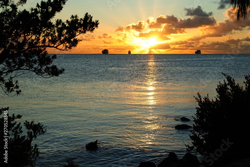 Amazing sunset view of the Saipan lagoon with ships in the distance 