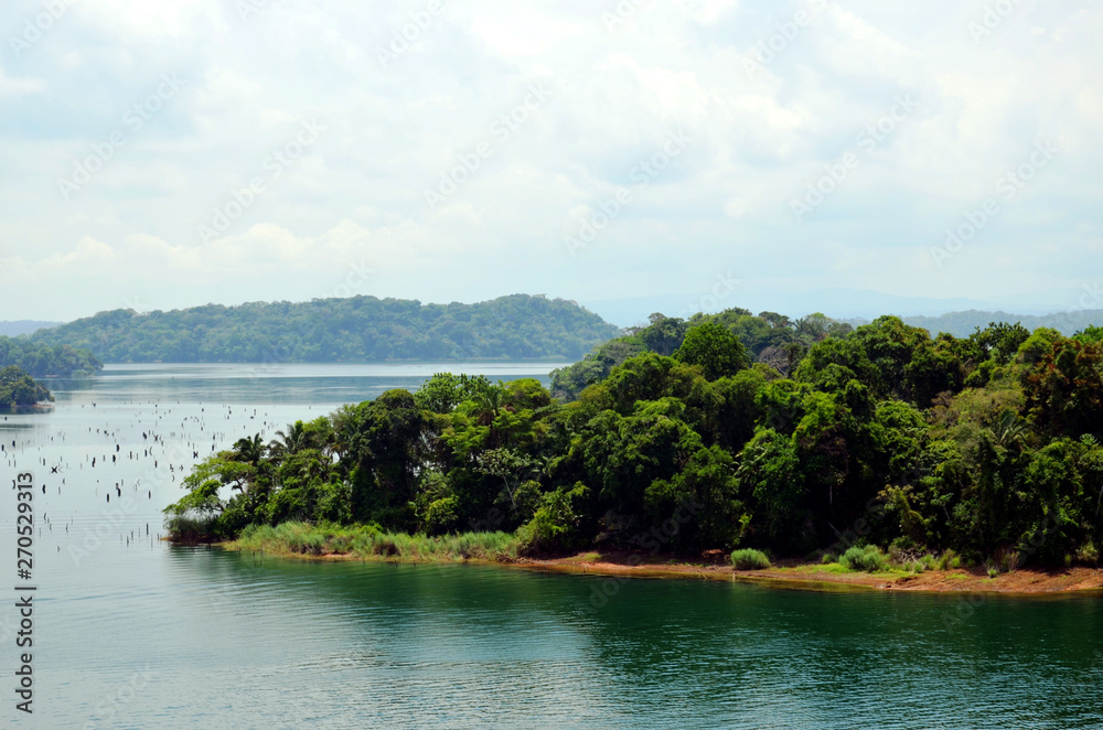 Landscapes of the Panama canal, view from the transiting cargo ship.