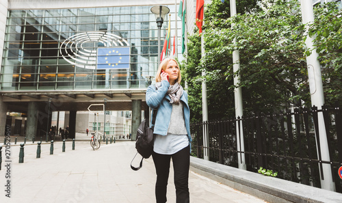 Woman talking on the phone in Brussels, Belgium.