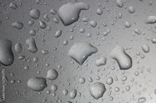 Raindrops on gray metal background