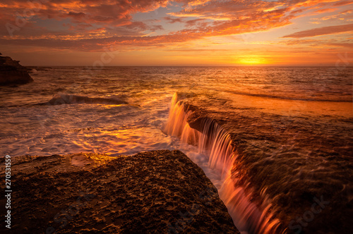 Photography Tidal waterfalls coloured by summer sunrise scenic landscape Australia