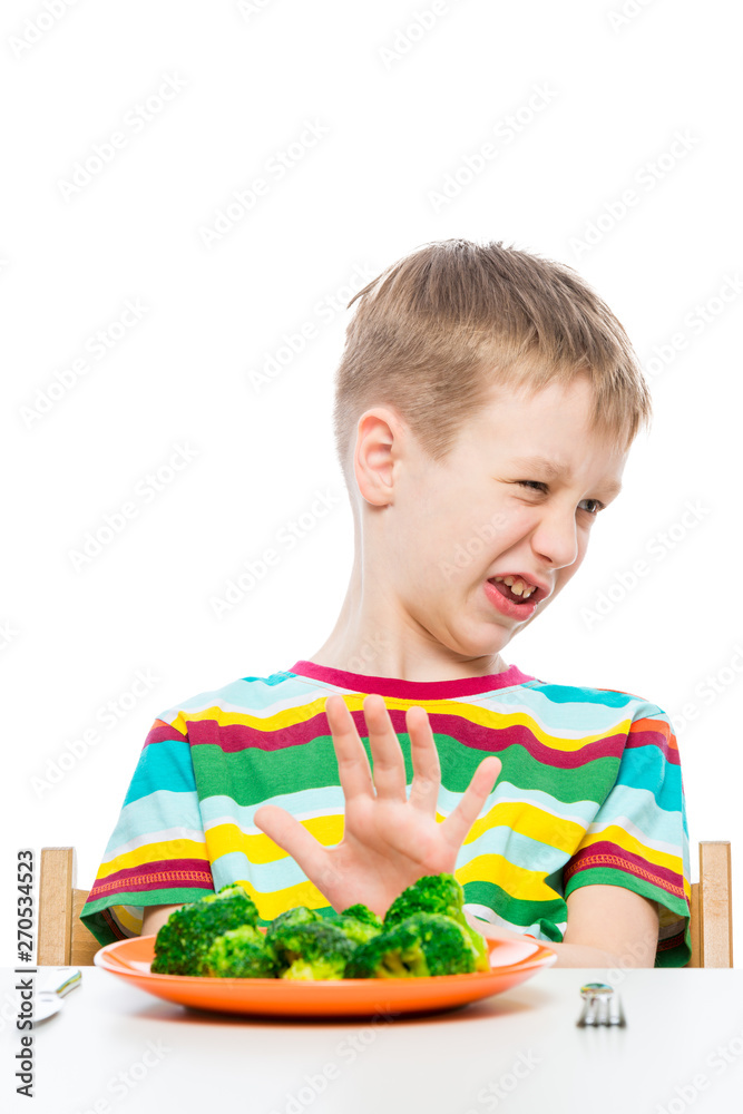 10-year-old boy refuses a plate of broccoli for lunch, concept photo ...