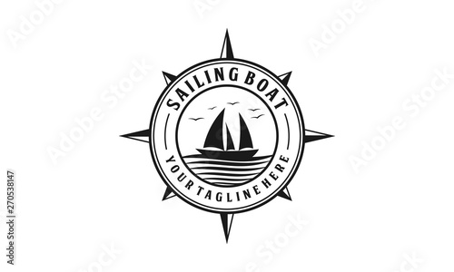 Sailing boat with ocean wave badge logo