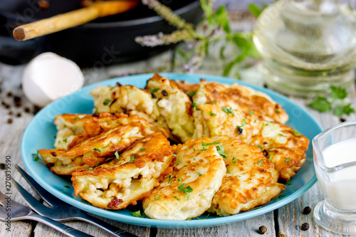 Pan fried zucchini pancakes stuffed with meat