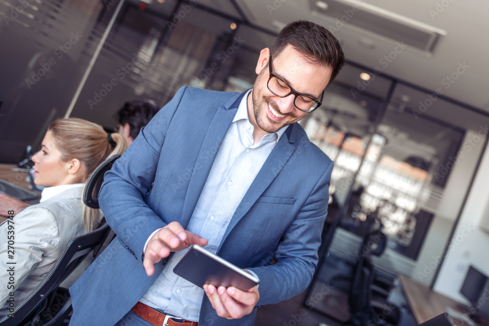 Businessman using tablet in office Businessman using tablet in office