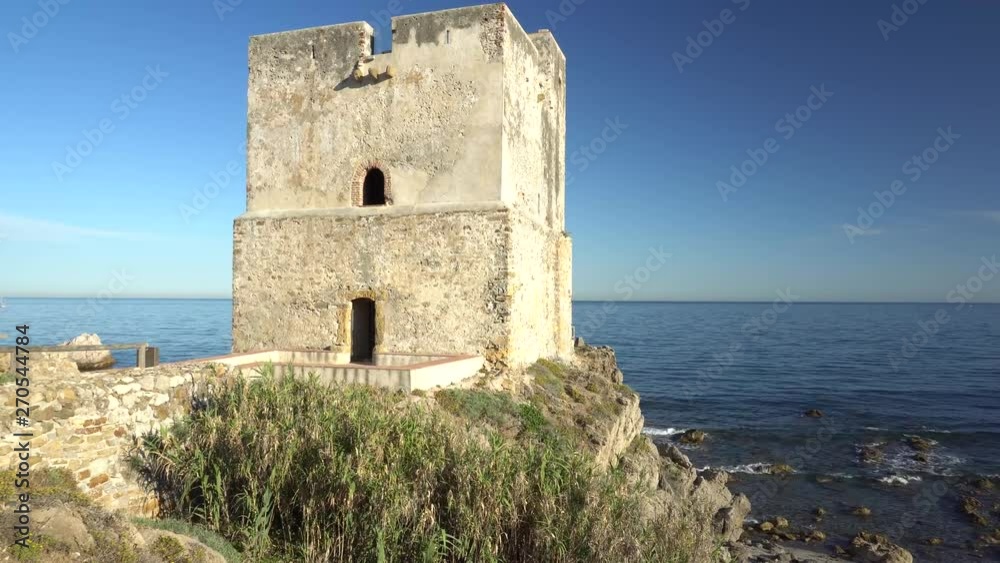 Spanish castle ruin, the Salt Tower overlooking the Mediterranean ocean Spanish castle ruin, the Salt Tower overlooking the Mediterranean ocean