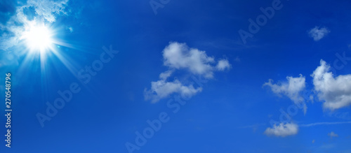 Beautiful blue sky cloudscape with shining sun