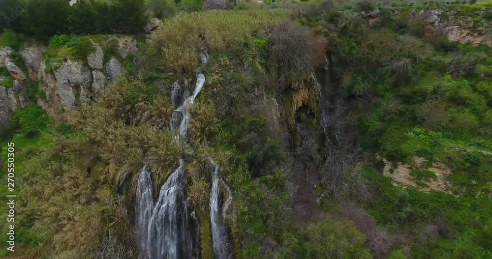 Cinematic Drone Aerial of Breathtaking Natural Waterfalls and Rocky Cliffs Covered With Trees in Cyprus Cinematic Drone Aerial of Breathtaking Natural Waterfalls and Rocky Cliffs Covered With Trees in Cyprus