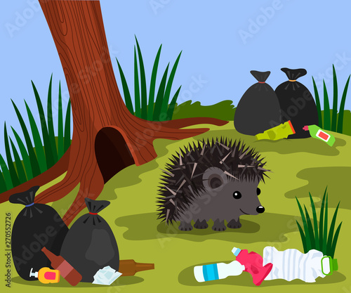 Ecological disaster from plastic waste in the forest. a cute hedgehog near his mink on the background of a landfill and garbage bags.
