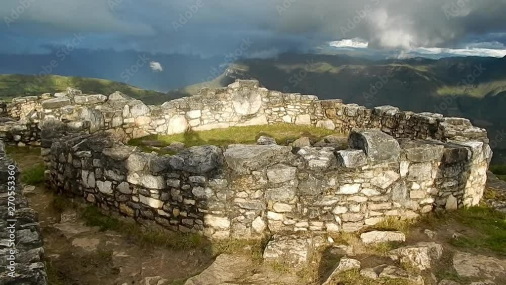 view of historical, Peruvian structures on Machu Picchu that have been abandoned and are in ruins view of historical, Peruvian structures on Machu Picchu that have been abandoned and are in ruins