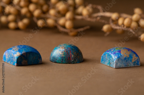 Modern chocolate bonbons on paper background