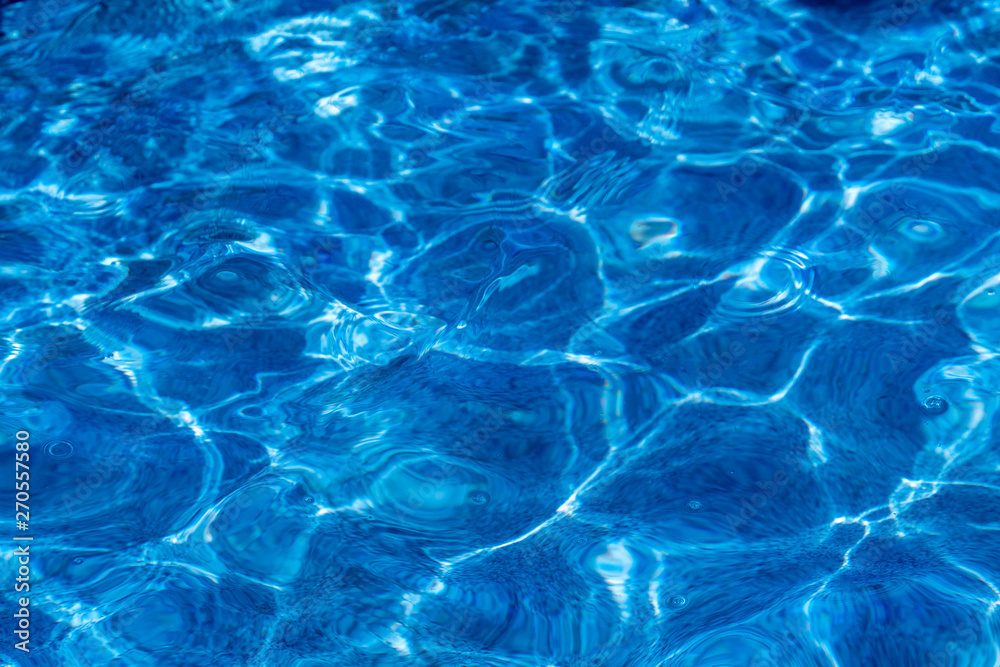 the texture of pure blue water in the pool