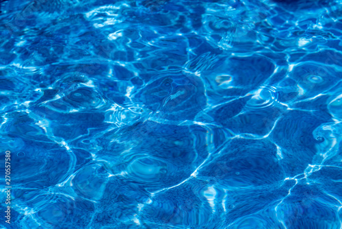 the texture of pure blue water in the pool
