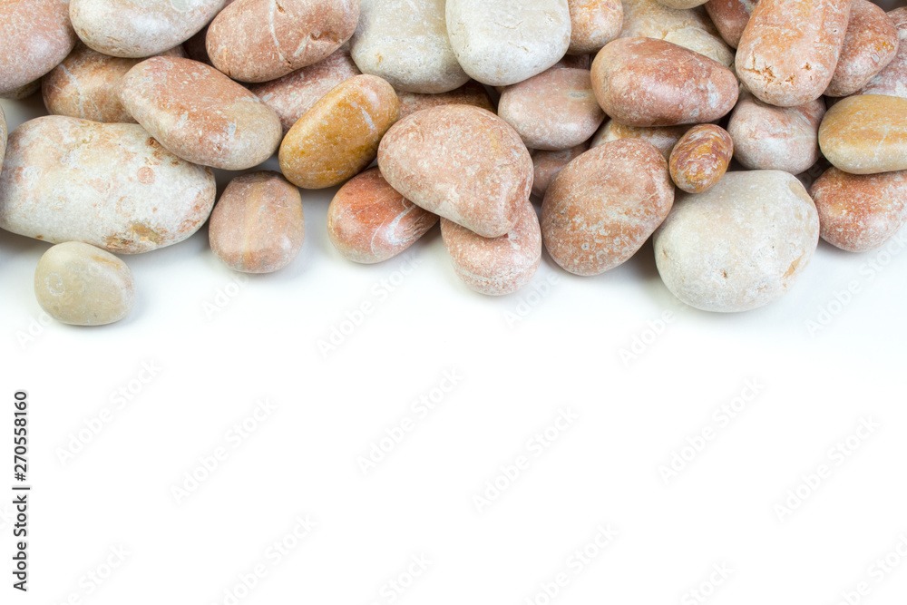Small sea stones, isolated on white. Top view with copy space Small sea stones, isolated on white. Top view with copy space