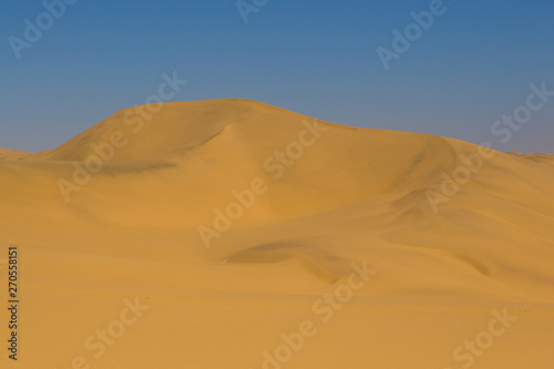 tall sand dune in Namib desert  blue sky