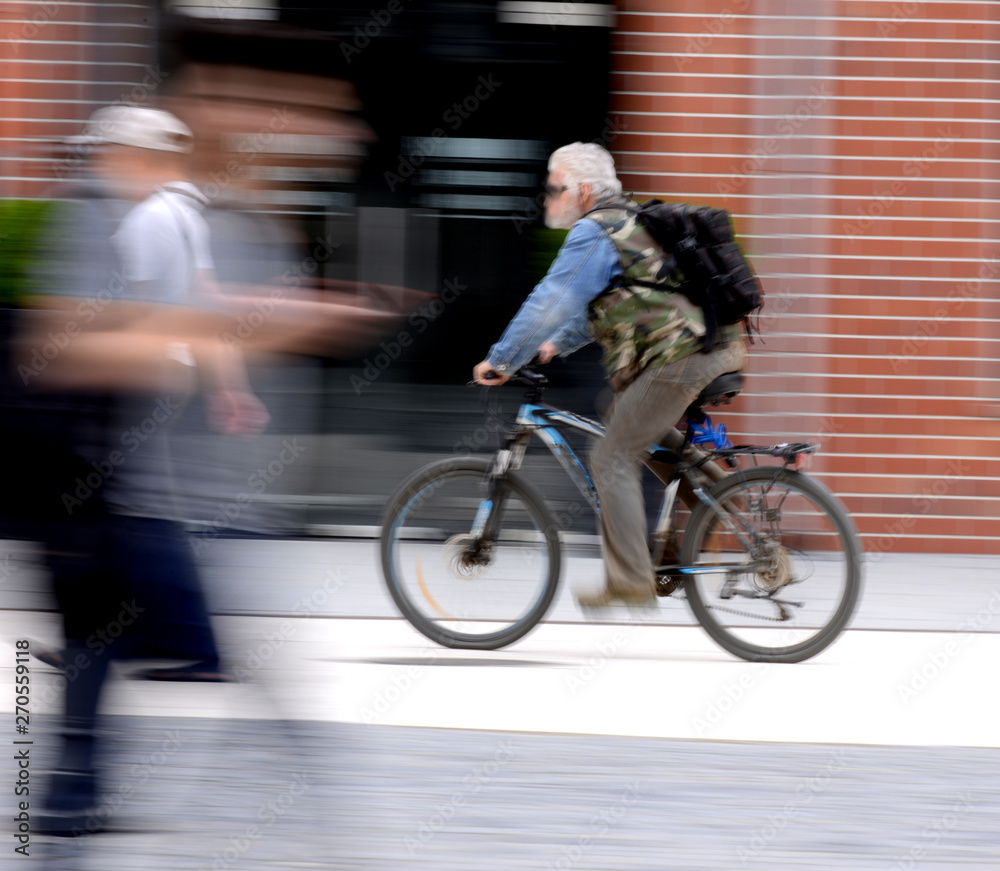 Cyclist on the city roadway in motion blur Cyclist on the city roadway in motion blur