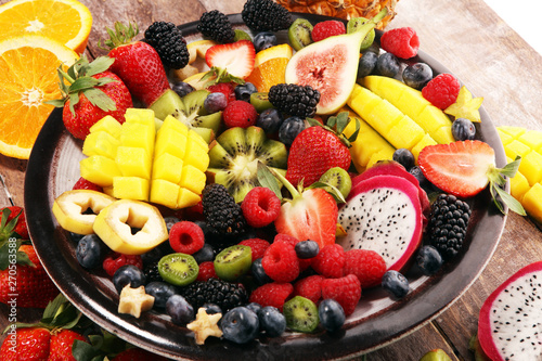 salad with fresh fruits and berries. healthy spring fruit salad with strawberries