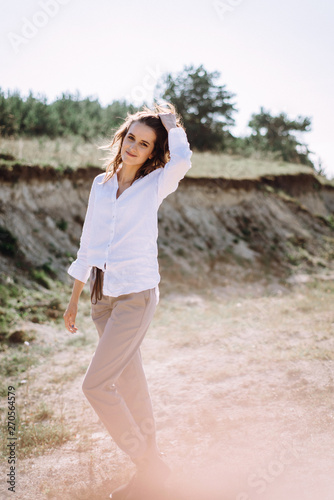 Beautiful and happy woman girl have fun and relax in summer. Portrait of a beautiful girl on the Planer near the cliff. Freedom for a walk © Oleksandr