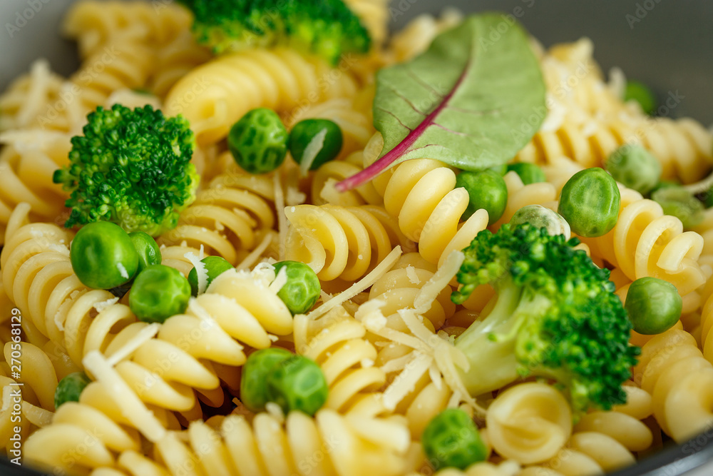 Pasta with broccoli and green peas