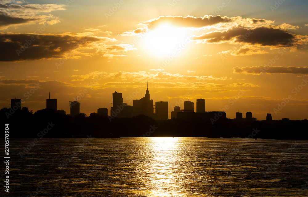 Silhouette of the city of Warsaw. Golden sunset