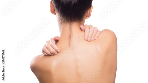 Pain. Woman touchig her neck. Massaging neck. Isolated on white.