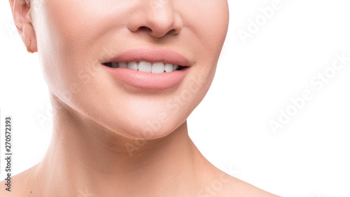Closse up view of a female smile. Dental concept. Close up view isolated on white background.