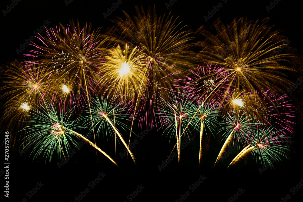 Colorful fireworks celebration and the midnight sky background.