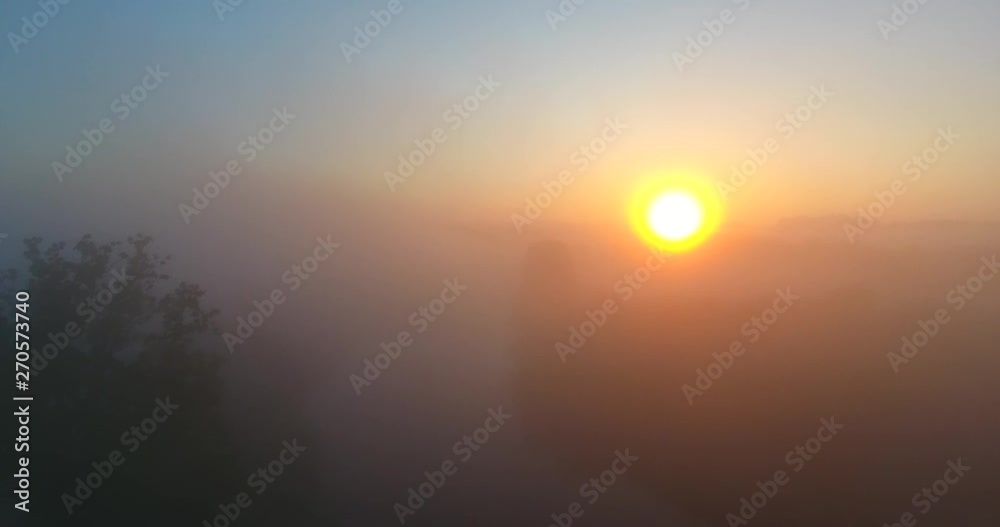 Aerial shot, moving up over green hills into morning fog - 009 Aerial shot, moving up over green hills into morning fog - 009