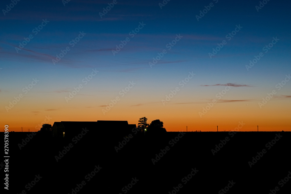 Twilight colors above a dutch farm in the period of the short summer nights, The Netherlands