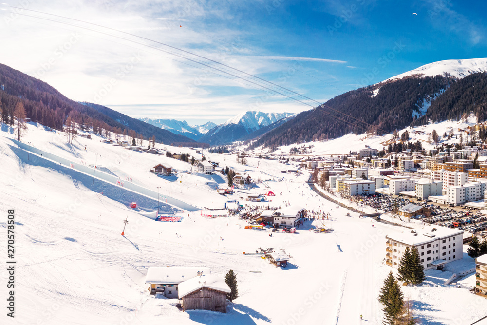 Aerial view of Davos city with ski slopes in the Winter, Grisons, Switzerland