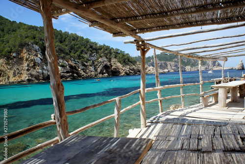 Fototapeta Naklejka Na Ścianę i Meble -  Benirras Bay.Coastal terrace of natural materials.Ibiza Island.Spain.	