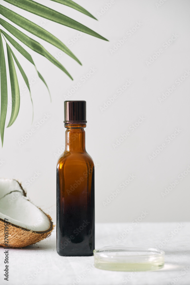 Obraz premium Spa cosmetics in brown glass bottles on gray concrete table. Copy space. Beauty blogger, salon therapy, minimalism concept