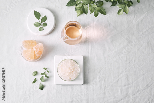Wallpaper Mural Aromatherapy. Small glass bottles with cosmetic oils. Bath salt. Fresh leaf. Objects for spa procedures on white background oil, leaf. Torontodigital.ca