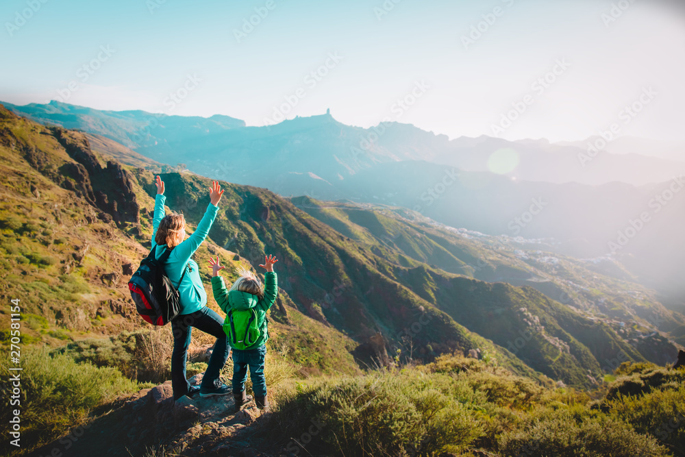 happy mother and daughter enjoy travel in mountains