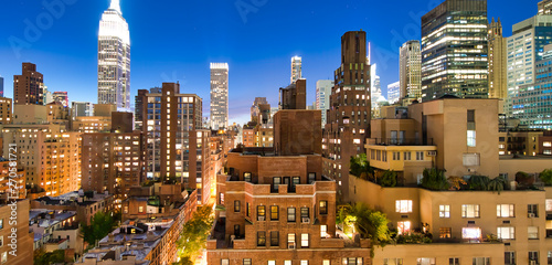 Photography Night aerial view of Midtown Manhattan skyline from a New York City rooftop