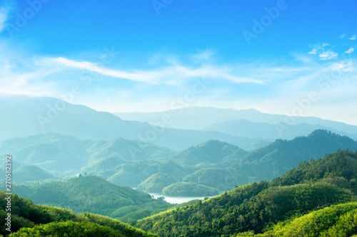 World Environment Day concept  Green mountains and beautiful sky clouds under the blue sky