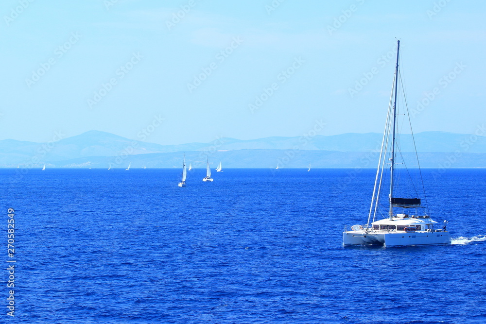 Nautical vessels on Adriatic sea near island Hvar, in Croatia; beautiful sunny day Nautical vessels on Adriatic sea near island Hvar, in Croatia; beautiful sunny day