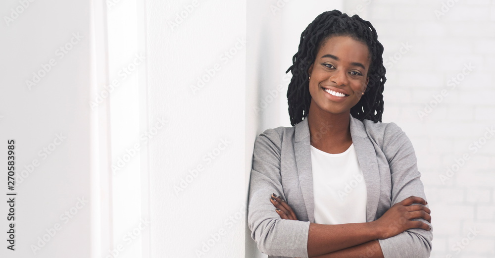 Businesswoman Leaning On Wall Near Window In Office Businesswoman Leaning On Wall Near Window In Office
