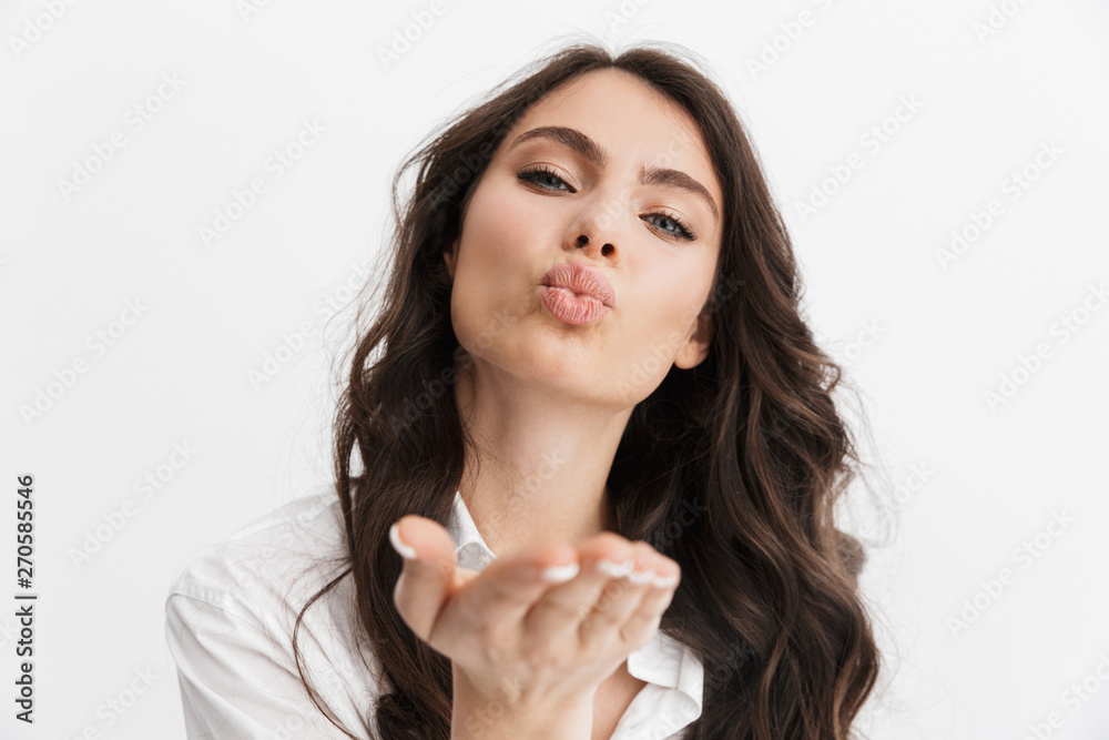 Beautiful young woman with long curly brunette hair Beautiful young woman with long curly brunette hair