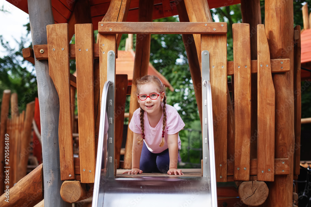 young girl in glasses goes in for sports on the playground. rest and childhood outdoors young girl in glasses goes in for sports on the playground. rest and childhood outdoors