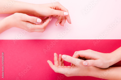 Stylish trendy female pink manicure.