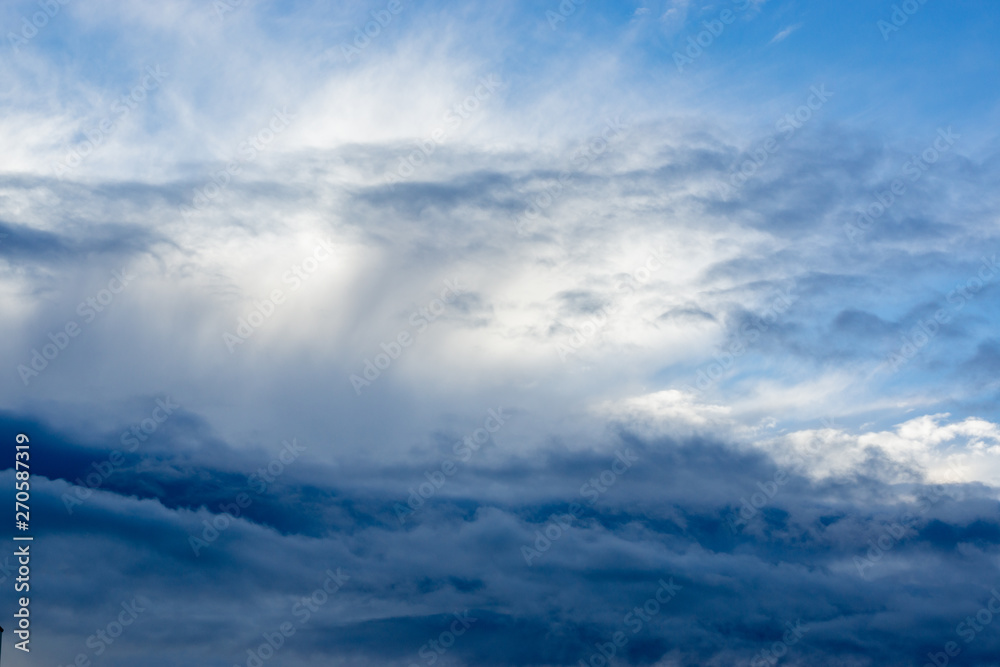 through the dark and white clouds you can see the blue sky. through the dark and white clouds you can see the blue sky.