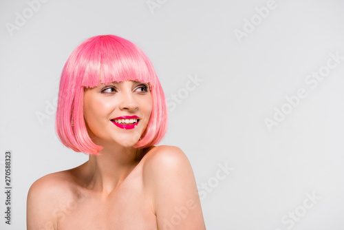 attractive smiling naked girl in pink wig isolated on grey
