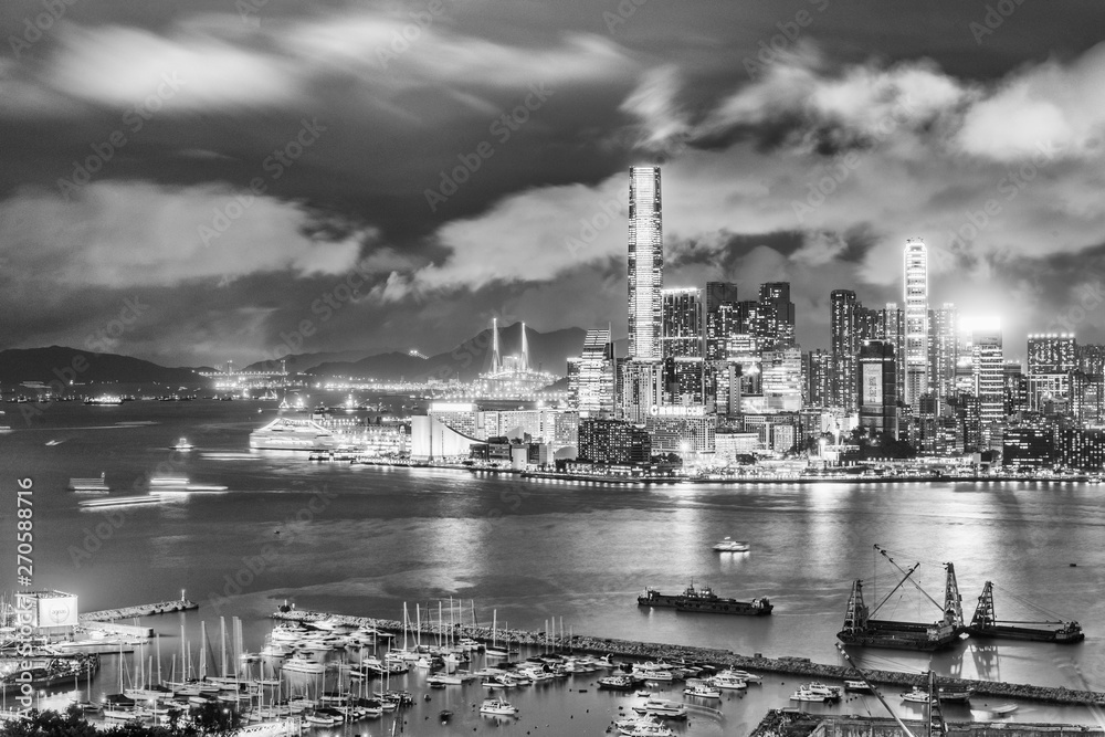 HONG KONG - MAY 4, 2014: Lights of Kowloon skyscrapers. Hong Kong hosts 15 million tourists annually
