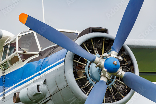 Pilots cabin and engine with four blade propeller of soviet aircraft biplane Antonov AN-2 closeup