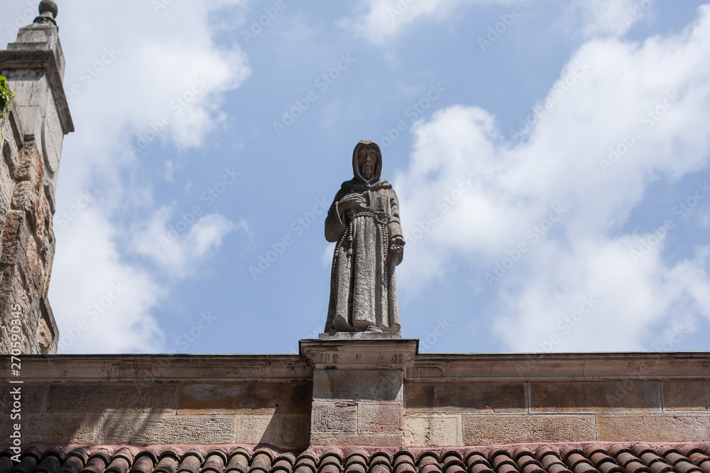 Budapest. Hungary. statue of a monk against the blue sky