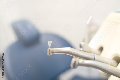 a dental tools for polishing teeth in the dental clinic in the background blurred chair for the patient