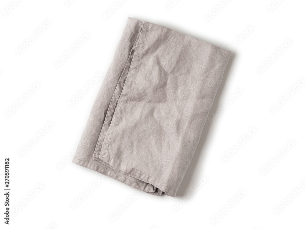 Folded gray linen napkin isolated on white background. Natural light gray linen napkin. Isolated on white with clipping path. Top view or flat lay.