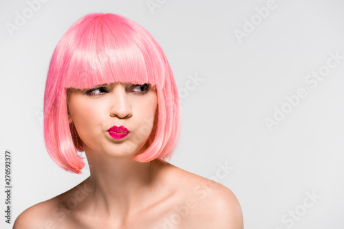 thoughtful naked girl in pink wig isolated on grey