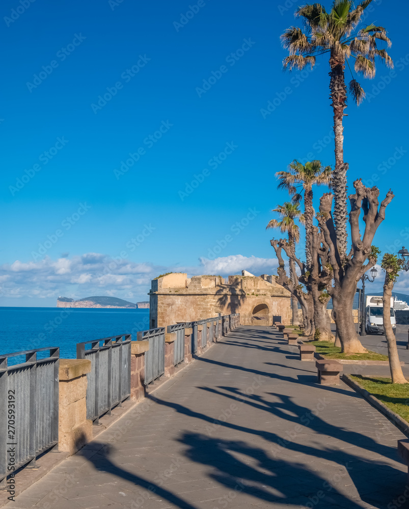 Fototapeta premium Gorgeous sea font and ramparts, Alghero (L'Alguer), province of Sassari , Sardinia, Italy. Famous for the beauty of its coast and beaches and its historical city center.